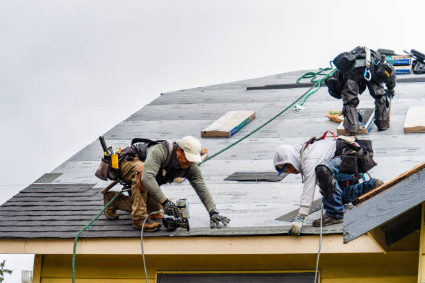 Professional Gutter Installation technician working in Lakewood, CA